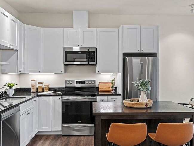 Building Photo - Prime Location Corner Condo – Modern & Low...