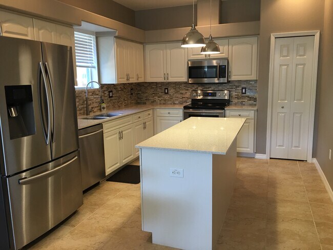 Newly updated kitchen with softclose cabinetry and custom tilework - 3103 W Napoleon Ave