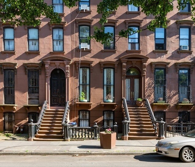 Wide sidewalks are lined with elegant brownstones in Bed-Stuy