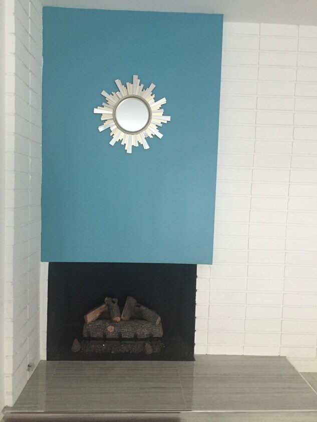 fireplace w/ new logs - 1214 Rutland Rd