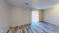 This 610 square foot apartment in Wichita, Kansas, offers a practical and contemporary living space. The layout comprises two bedrooms, a living room, a bathroom, and a hallway, efficiently arranged on a single floor. The primary bedroom is a spacious 120 square feet, providing ample room for comfortable living.

The apartment features a mix of flooring types, adding character to each space. The living area and one bedroom showcase attractive wood-look flooring, while the other bedroom is fitted with plush carpeting. The recently renovated bathroom boasts a modern design with a glass-enclosed shower/tub combination, a sleek vanity, and durable wood-look flooring that complements the overall aesthetic.

Natural light floods the rooms through windows equipped with blinds or vertical slats, creating a bright and airy atmosphere. The neutral color palette of the walls provides a versatile backdrop for various decor styles. Ceiling-mounted light fixtures in each room ensure adequate illumination throughout the day and night.

Storage solutions include a mirrored sliding closet door in one of the bedrooms, maximizing space efficiency. The compact yet functional layout makes this apartment an ideal choice for those seeking a modern, low-maintenance living space in the heart of Wichita.