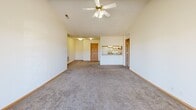 Located at 2901 Fletcher Ave in Lincoln, Nebraska, this 2-bedroom, 1-bathroom home offers a well-designed single-floor layout with a welcoming and functional interior. The open-concept living room is a standout feature, boasting soaring vaulted ceilings, a ceiling fan, and a gas fireplace framed by a clean white mantel. A sliding glass door floods the space with natural light and opens to a private balcony with outdoor views, creating a seamless indoor-outdoor connection. Soft carpeting extends throughout the living area and bedrooms, adding warmth underfoot.

The galley-style kitchen features white cabinetry with wood trim accents, granite-look countertops, a double sink, and tile flooring. It connects directly to a dedicated laundry room equipped with a full-size washer and dryer. Two carpeted bedrooms offer comfortable proportions, with the generously sized primary bedroom providing ample space. The second bedroom includes a window with vertical blinds for natural light and privacy. The full bathroom includes a tub/shower combination and tile flooring. Two closets provide additional storage throughout the home, rounding out this practical and comfortable Lincoln residence.