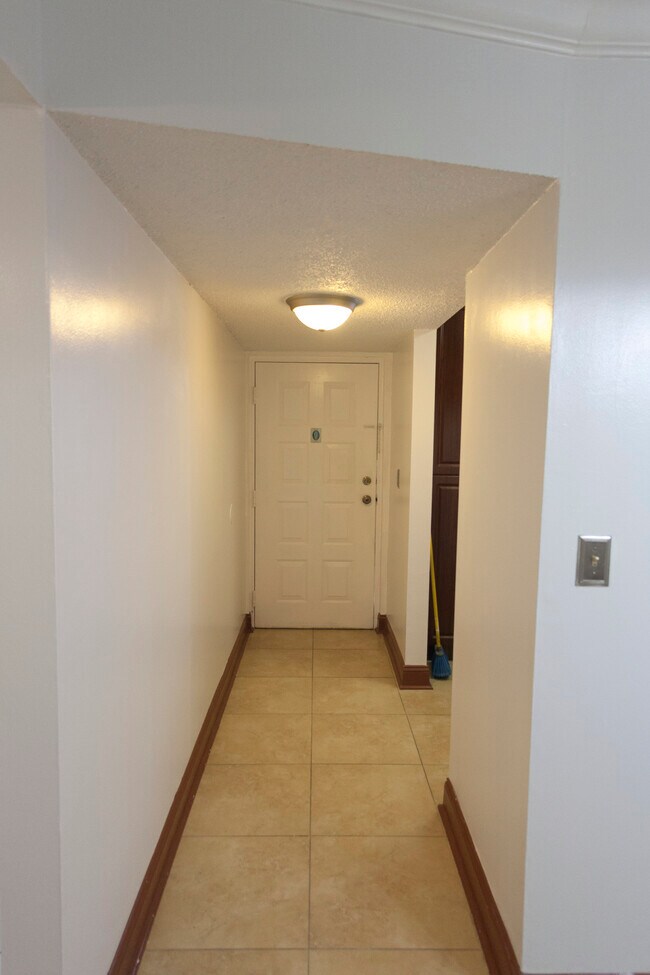 Hallway Coming From Front Door - 6081 W 24th Ave