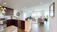 Discover the epitome of urban elegance in this exquisite 1,100 sq ft apartment at 3232 Peachtree Rd NE, Atlanta. This sophisticated retreat offers two generously-sized bedrooms, including a luxurious 160 sq ft primary suite, and two designer bathrooms that redefine modern living. The heart of this home is a chef's dream kitchen, boasting rich wood cabinetry, sleek stainless steel appliances, and a stylish breakfast bar perfect for casual dining or entertaining. The open-concept living area is bathed in natural light, showcasing spectacular city views through floor-to-ceiling windows. Plush carpeting in the bedrooms provides comfort underfoot, while the living spaces feature premium wood-look flooring. The thoughtfully curated interior design seamlessly blends contemporary and classic elements, creating an atmosphere of refined luxury. Practical amenities include a convenient in-unit laundry and ample storage space. Located in the coveted Buckhead neighborhood, this property offers the perfect balance of vibrant city living and serene comfort. Embrace the lifestyle you've always dreamed of in this urban oasis that truly feels like home.