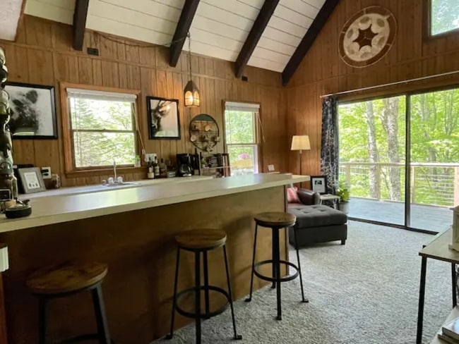 A kitchenette on the middle level makes for convenient entertaining. - 128 Lower Grouse Ridge Rd