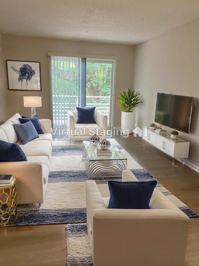 Renovated staged living roomm - Residences at Port Royal