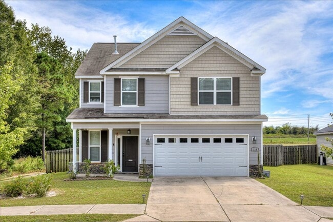 Building Photo - 4 bed, 2.5 bath home on corner lot with 2 car garage and fenced in back yard