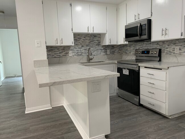 New marble countertop, new stainless steel appliances including fridge - 6390 Rancho Mission Rd