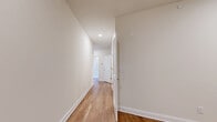 Located at 339 W Broad St in Westfield, NJ, this well-designed single-floor residence offers 2 bedrooms and 3 bathrooms across a generously sized floor plan. Warm hardwood flooring flows throughout the main living areas and bedrooms, complemented by neutral wall tones that create a bright, clean aesthetic throughout.

The open-concept kitchen and living area serves as the heart of the home. The kitchen features white shaker-style cabinetry, stainless steel appliances, a modern tile backsplash, quartz countertops, and a center island with seating — all bathed in natural light from a large arched window. The adjacent living room is expansive, with two large windows that flood the space with natural light and offer outdoor views.

The spacious primary bedroom is a standout, featuring an arched window for natural light and a generous walk-in closet outfitted with wire shelving systems and hardwood flooring. The bathrooms are tastefully finished with tile flooring, glass-enclosed walk-in showers, white cabinetry, and sleek fixtures. A dedicated laundry area and hallway with recessed lighting add to the home's functional layout. The clean, modern design throughout makes this a highly livable and well-organized residence.