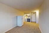 Located on Holmead Place NW in Washington, DC, this one-bedroom, one-bathroom unit offers a practical and well-organized layout across a single floor. The open-concept living, dining, and kitchen area forms the heart of the space, featuring neutral-toned carpet, light-colored walls, and a functional kitchen equipped with white cabinetry, a gas range, and a full-size refrigerator. The kitchen flows seamlessly into the living and dining area, maximizing the usable space and creating a cohesive gathering zone.

The bedroom is a comfortable, carpeted room with a large window that allows natural light to fill the space. A radiator beneath the window provides heating, and a double-door closet offers ample storage. In total, the unit includes three closets, ensuring generous storage options throughout.

The bathroom features a clean, tiled tub-shower combination, a compact vanity with under-sink cabinet storage, a wall-mounted mirror, and a toilet — all finished in a simple, neutral palette with wood-look flooring.

The unit's straightforward design, neutral finishes, and efficient use of space make it a functional residence in a well-situated Washington, DC neighborhood.
