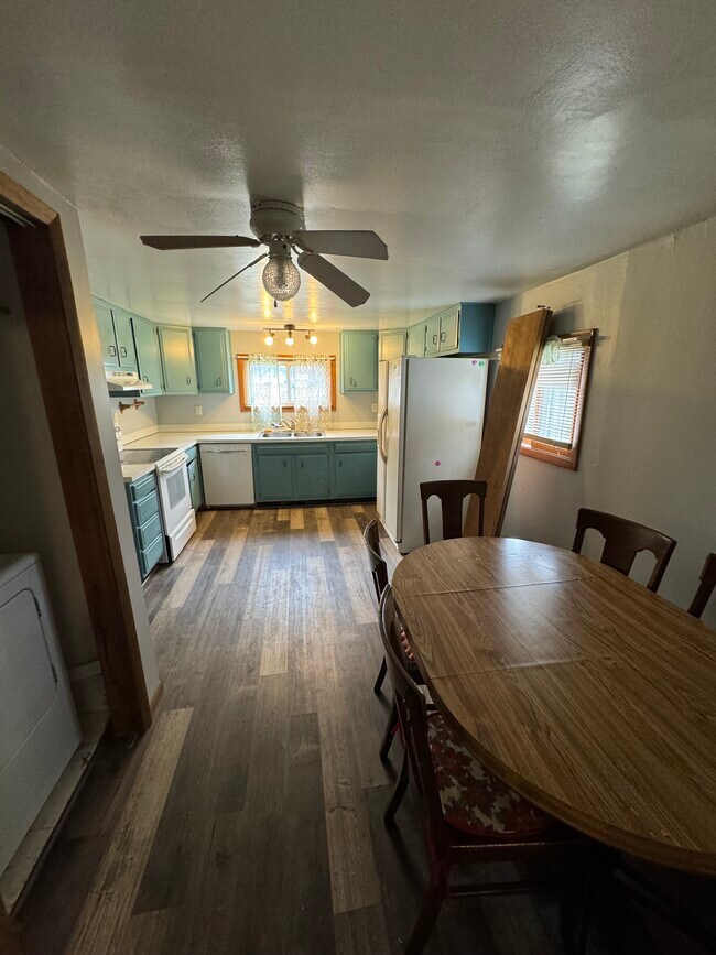 Kitchen open to dining area - 409 Austin St