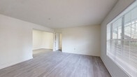 This contemporary apartment offers 860 square feet of thoughtfully designed living space. The open floor plan creates a seamless flow between the living area and kitchen, ideal for both everyday living and entertaining. The kitchen boasts modern white cabinetry, granite countertops, and stainless steel appliances, including a spacious refrigerator.

Both bedrooms feature plush carpeting and large windows that allow natural light to flood the spaces. The primary bedroom is generously sized at 180 square feet, providing ample room for a king-size bed and additional furniture. The bathrooms are equipped with modern fixtures, including bathtubs with grab bars for added safety and convenience.

The living area showcases beautiful wood-look flooring, creating a warm and inviting atmosphere. In-unit laundry facilities add to the convenience of this home. The apartment's neutral color palette provides a blank canvas for personal decorating styles.

Located at 2255 Lenox Rd NE in Atlanta, this property offers urban living with easy access to local amenities. The single-story layout ensures accessibility throughout the space. With its modern finishes, practical layout, and desirable location, this apartment presents an attractive option for those seeking a contemporary living space in Atlanta.