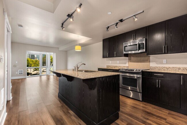 Building Photo - Modern 1-Bedroom + Den Condo with Parking, Storage & Rooftop Access – Marselle Condominiums