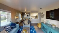 Located at 4315 Norwood Ave in Sacramento, CA, this single-story apartment offers a thoughtfully designed open-concept layout that maximizes functionality and flow. The living area features wood-look flooring, neutral wall tones, and natural light from front-facing windows, creating a warm and inviting atmosphere. A ceiling fan anchors the adjacent dining nook, which benefits from its own window and connects seamlessly to both the living space and kitchen.

The kitchen is designed with white cabinetry, a tile backsplash, and stainless steel appliances including a gas range, microwave, and refrigerator. A pass-through counter opens the kitchen toward the dining and living areas, enhancing the sense of openness throughout the main living space.

Two bedrooms provide comfortable retreats, each carpeted and finished with neutral walls. One bedroom features a large sliding glass door that opens to a private outdoor patio with greenery views, while the second bedroom includes a standard window with natural light. A full bathroom with a tub-shower combination, white vanity, and wood-look flooring serves the unit. In-unit laundry hookups are also present, adding everyday convenience to this well-rounded Sacramento residence.