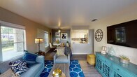 Located at 4315 Norwood Ave in Sacramento, CA, this single-story apartment offers a thoughtfully designed open-concept layout that maximizes functionality and flow. The living area features wood-look flooring, neutral wall tones, and natural light from front-facing windows, creating a warm and inviting atmosphere. A ceiling fan anchors the adjacent dining nook, which benefits from its own window and connects seamlessly to both the living space and kitchen.

The kitchen is designed with white cabinetry, a tile backsplash, and stainless steel appliances including a gas range, microwave, and refrigerator. A pass-through counter opens the kitchen toward the dining and living areas, enhancing the sense of openness throughout the main living space.

Two bedrooms provide comfortable retreats, each carpeted and finished with neutral walls. One bedroom features a large sliding glass door that opens to a private outdoor patio with greenery views, while the second bedroom includes a standard window with natural light. A full bathroom with a tub-shower combination, white vanity, and wood-look flooring serves the unit. In-unit laundry hookups are also present, adding everyday convenience to this well-rounded Sacramento residence.