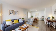Located in Daly City, CA, this well-designed 1-bedroom, 1-bathroom residence offers a thoughtful single-floor layout that maximizes every square foot. The open-concept living and dining area is anchored by warm hardwood-style flooring throughout, with large windows dressed in vertical blinds that allow generous natural light to fill the space. The living area provides ample room for seating and entertaining, flowing seamlessly into a dedicated dining space. A functional kitchen features white cabinetry, granite-style countertops, a stainless steel sink, and a window with blinds that brings in additional natural light. Ample storage is provided through a pantry and dedicated closet. The bedroom is a serene retreat, finished with plush carpeting and floor-to-ceiling vertical blinds framing a large window with outdoor views. The full bathroom includes a soaking tub and shower combination with speckled surround walls, a white vanity, and a privacy window above. Throughout the residence, crisp white walls, consistent flooring materials, and a clean, neutral palette create a bright and cohesive ambiance that is both inviting and highly functional.