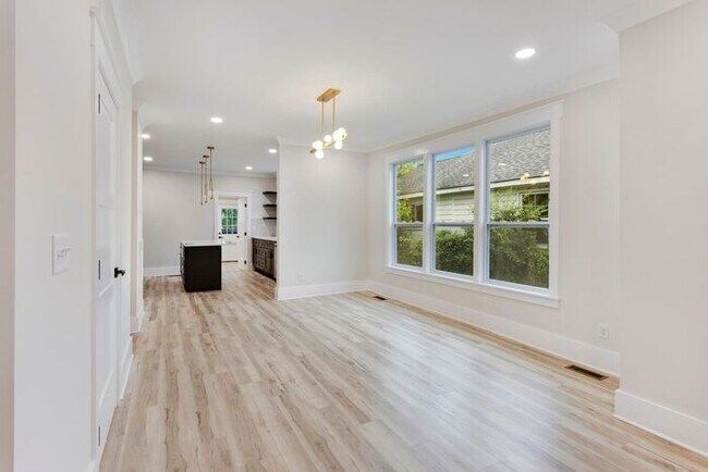 Building Photo - Fully Renovated 3 Bedroom Home With BACKYA...
