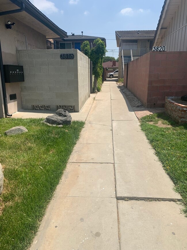 Walk way to your unit - 3814 S. Bronson Ave