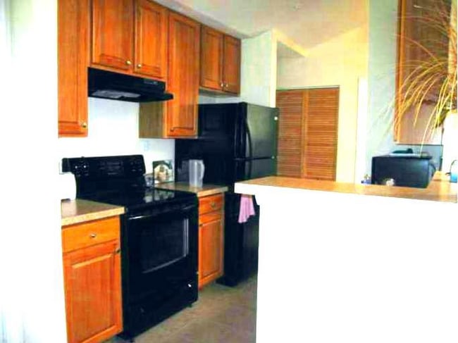 Kitchen has lots of cabinets & counter space! - 9902 Boysenberry Way
