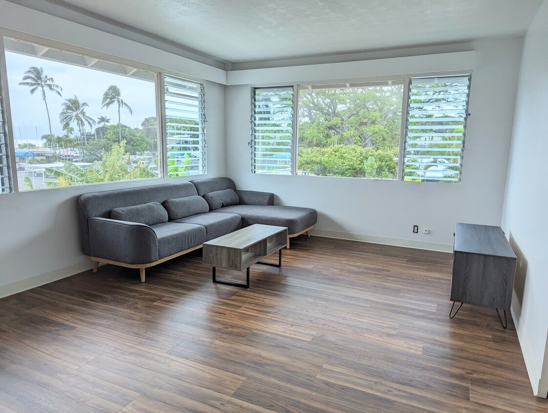 Living room showing new flooring and furniture - 44-511 Kaneohe Bay Dr