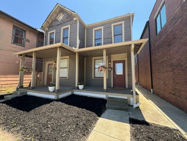 Building Photo - 311-313-313 E 5th Ave