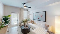 Located at 6026 Whitaker Rd in Naples, FL, this single-floor, 2-bedroom, 1-bathroom home delivers a thoughtfully designed layout with modern finishes throughout. The open-concept living area seamlessly connects the kitchen, dining, and living spaces, creating an efficient yet inviting atmosphere. The kitchen is outfitted with flat-front cabinetry in a warm greige tone, white quartz countertops, stainless steel appliances including a refrigerator, electric range, microwave, and dishwasher, plus a central island with bar seating and woven pendant lighting overhead. The living room features light wood-style flooring, a ceiling fan, and large windows that invite natural light, with direct access to a private patio. Both bedrooms are comfortable retreats, each equipped with a ceiling fan, natural light from windows, and dedicated closet space. The primary bedroom is generously sized. The shared bathroom includes a tub-shower combo with tiled surround, a single vanity with quartz countertop, and black hardware accents. A dedicated laundry area adds everyday convenience. The home's bright, neutral palette and coastal-inspired design details reflect the relaxed Naples lifestyle.