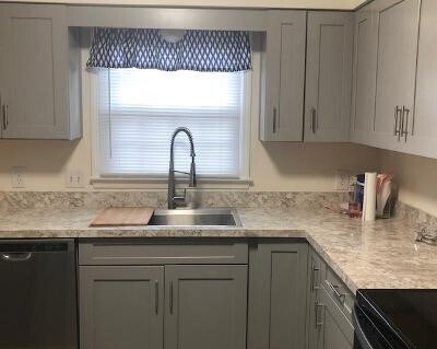 Kitchen with new cabinets, appliances and vinyl plank flooring - 145 Bard Dr