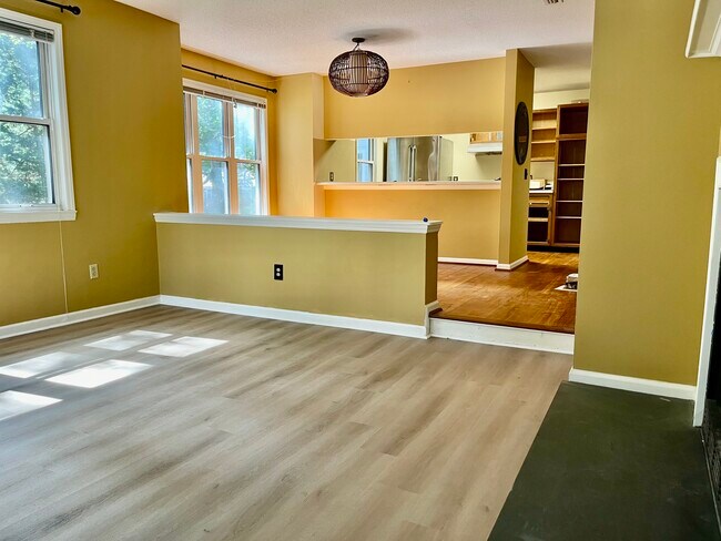 Living room new floor adjacent to wood dining area - 245 Oakwood Ct