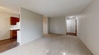 Located at 1721 Marion St in Roseville, MN, this 2-bedroom, 1-bathroom unit offers a practical and comfortable layout across a single floor. The combined kitchen and living room area serves as the heart of the home, with the kitchen featuring warm wood cabinetry, a double-basin sink, and light marble-patterned countertops, all complemented by durable hardwood-style flooring. The open living area is carpeted and provides a generous, versatile space ideal for both relaxing and entertaining, with easy access to the rest of the unit. Both bedrooms are carpeted and filled with natural light through red-trimmed windows that frame pleasant outdoor greenery. Each room is equipped with baseboard heating, and the primary bedroom includes a ceiling fan and a mirrored sliding-door closet, offering practical storage. The second bedroom also features a ceiling fan, adding to the comfort of the space. The bathroom is clean and functional, complete with a full tub and shower combination enclosed by white tile surround. A dedicated closet provides additional storage. Overall, the unit presents a straightforward, well-organized floor plan suited for comfortable everyday living in a convenient Roseville location.
