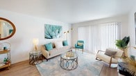 Located at 10343 San Diego Mission Rd in San Diego, CA, this single-floor residence offers a thoughtfully designed layout with a clean, contemporary aesthetic throughout. The open living area is a welcoming focal point, featuring wood-style flooring, a large sliding glass door with vertical blinds that invites abundant natural light, and ample space for relaxed seating arrangements. The kitchen is outfitted with sleek white cabinetry, a marble-style tile backsplash, stainless steel appliances including a range, microwave, and refrigerator, and a deep stainless sink beneath stylish pendant lighting — offering both functionality and modern appeal. The bedrooms are bright and restful, each featuring natural light from well-positioned windows dressed with sheer curtains and horizontal blinds. Soft neutral tones and plush flooring create a calm, comfortable atmosphere in these private retreats. The bathroom maintains the home's clean design language with white cabinetry, a single vanity, a full tub-shower combination, and wood-style flooring that ties seamlessly to the rest of the home. Throughout the residence, the consistent use of white walls, modern fixtures, and natural light contributes to an airy, cohesive ambiance that is both inviting and functional.