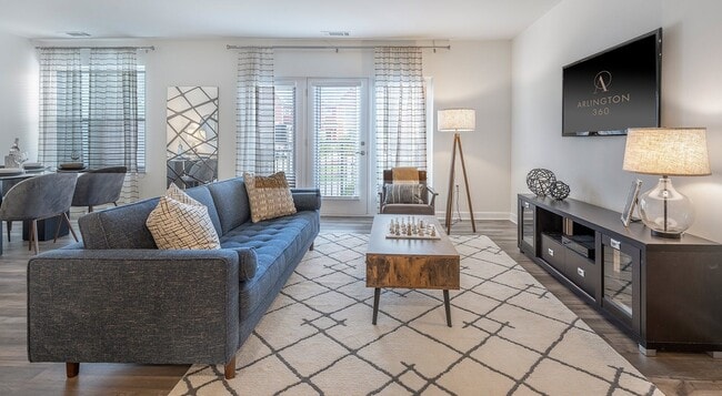 Light comes from the patio door at one end and from lamps at the other. - Arlington 360