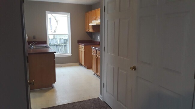 Living Room to kitchen (utility closet) - 1216 Lipps Ln