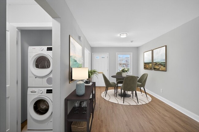 Step into the inviting interiors of Eagle Rock Apartments at Woodbury. With a modern dining area, convenient in-unit laundry, and natural light streaming through large windows, this is your perfect home. Schedule a tour today to see for yourself! - Eagle Rock Apartments at Woodbury