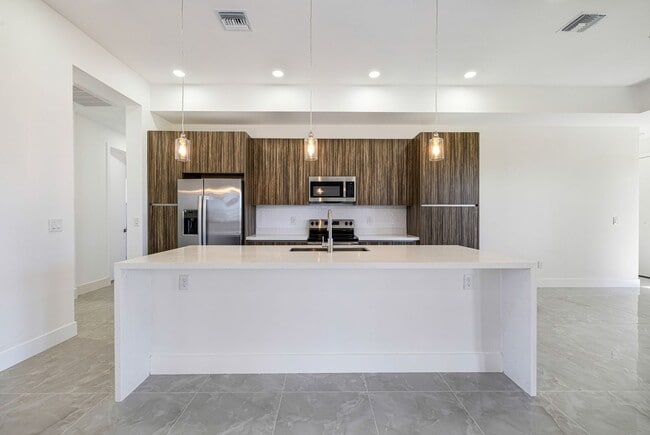 Building Photo - Brand-New Coastal Retreat | 4BR Home in NW Cape Coral