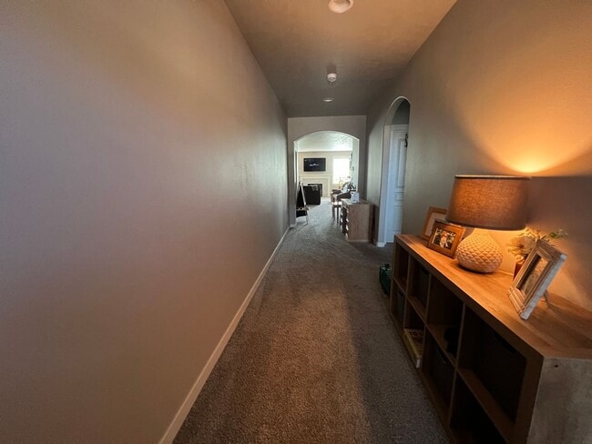 Building Photo - Single level, triple car garage and A/C!
