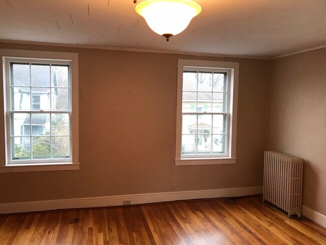 Large windows allowing natural light into living room - 30 Paige St