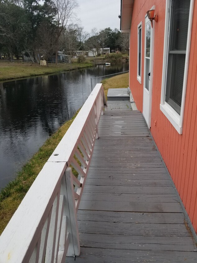 left side of house on pond - 2557 S Bluebeard Trail SW