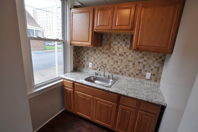 Building Photo - Spacious and Charming Efficiency Apartment...