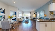 Located at 2615 E Date Palm Paseo in Ontario, CA, this well-appointed 2-bedroom, 2-bathroom residence offers a thoughtfully designed single-floor layout that maximizes both comfort and functionality. Rich hardwood-style flooring flows throughout the open-concept living and dining areas, creating a warm, cohesive aesthetic. Large windows and a sliding glass door flood the living room with natural light while providing views of the surrounding exterior, and a dedicated workspace nook adds practical versatility to the main living area.

The kitchen is outfitted with stainless steel appliances — including a gas range, refrigerator, dishwasher, and microwave — paired with crisp white cabinetry, sleek grey countertops, and tile flooring, offering an efficient and stylish cooking space.

The primary bedroom is a well-sized retreat with hardwood-style flooring, access to its own bathroom, and a calm, neutral palette. The second bedroom features striking navy accent walls, hardwood-style flooring, and a bright window, making it an inviting and versatile space.

Both bathrooms are finished with tile flooring, white cabinetry, grey countertops, and large mirrors. The primary bath includes a soaking tub-shower combination, while the secondary bath provides additional convenience. The overall ambiance throughout is modern, clean, and bright.