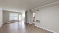 Located at 270 Brandywine Dr in Bear, Delaware, this single-floor, 3-bedroom, 2-bathroom home offers a well-organized layout with thoughtful finishes throughout. The open living area features light wood-style flooring, neutral tones, and crown molding, creating a clean and cohesive aesthetic. Large windows and a glass-paned door allow natural light to flow through the living space, which connects seamlessly to a galley-style kitchen equipped with stainless steel appliances including a range, microwave, and dishwasher, complemented by granite-style countertops and white cabinetry.

The three bedrooms are carpeted for comfort, with the primary bedroom offering direct access to its own bathroom and a dedicated closet. The secondary bedrooms are well-sized and benefit from windows that bring in natural light. Both bathrooms are finished with granite-style countertops, white vanities, large mirrors, and tub-shower combinations with light wood-style flooring.

A dedicated laundry room houses a full-size washer and dryer with additional wire shelving for storage. The attached garage provides convenient vehicle storage with an automatic opener. Hallways connect the rooms efficiently, completing this functional and move-in-ready home.