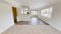 Located at 17112 Waverly Way in Baltimore, MD, this 2-bedroom, 1-bathroom home offers a well-organized single-floor layout designed for comfortable everyday living. The combined kitchen and living room serves as the heart of the home, featuring wood-look flooring, recessed lighting, and a clean, open flow between spaces. The kitchen is equipped with white cabinetry, a stainless steel refrigerator, range, dishwasher, and a window that brings in natural light. A peninsula counter provides additional workspace and visual separation from the living area. The living room extends the space further, with a large window overlooking the neighborhood streetscape, allowing ample daylight to fill the room. Both bedrooms are carpeted and finished in neutral tones, each featuring windows with outdoor views of surrounding greenery. The primary bedroom offers a comfortable, well-proportioned layout. The full bathroom includes a tub-shower combination, vanity with storage, wood-look flooring, and a frosted window for privacy and light. A hallway connects the main rooms efficiently, completing the functional and cohesive layout of this Baltimore home.