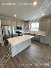 Building Photo - W218N16014 Tiger Lily Dr