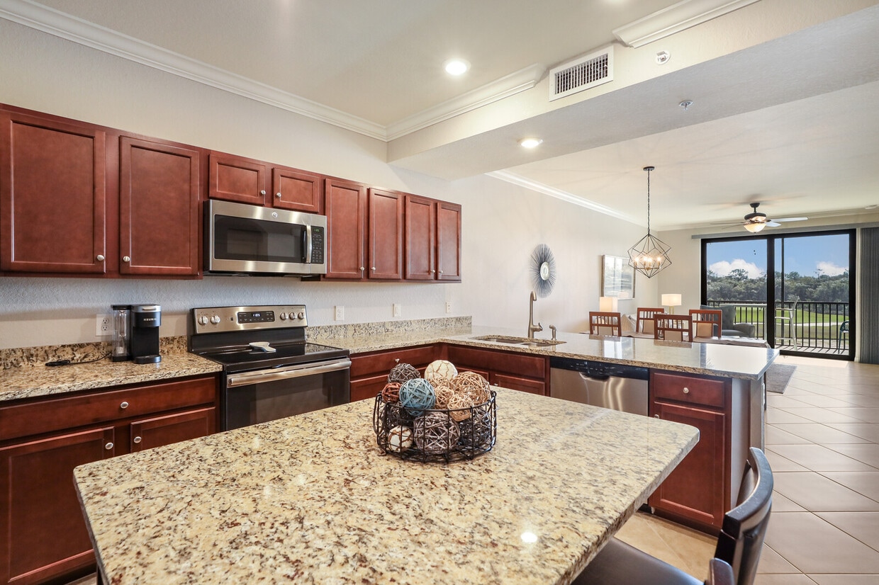 Open kitchen with granite & stainless appliances - 16904 Vardon Ter