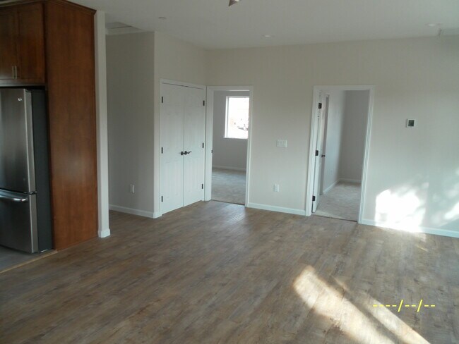Family room with bedroom doors - 915 Oriole Way