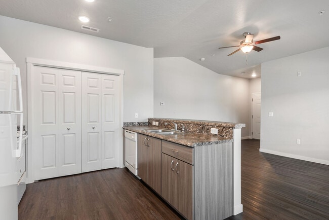 KITCHEN AND LAUNDRY AREA - Faith Landing Apartments