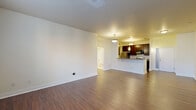 Located at 530 E Ohio St in Indianapolis, this well-appointed 2-bedroom, 2-bathroom residence offers a thoughtfully designed single-floor layout. The open-concept living and kitchen area serves as the heart of the home, featuring rich hardwood-style flooring, neutral walls, and abundant natural light from large windows. The kitchen is equipped with stainless steel appliances, including a refrigerator and range, complemented by dark espresso cabinetry, granite-style countertops, and a peninsula with pendant lighting that provides additional seating and prep space. The generously sized primary bedroom features plush carpeting, a large window with outdoor views, a walk-in closet, and direct access to a private en-suite bathroom. The second bedroom also features hardwood-style flooring and large windows that fill the room with natural light. Both bathrooms are clean and functional, with one offering a full tub-shower combo with white tile surround. Additional highlights include three closets for ample storage, a dedicated laundry area, and a connecting hallway that ensures a practical and well-organized flow throughout the residence.