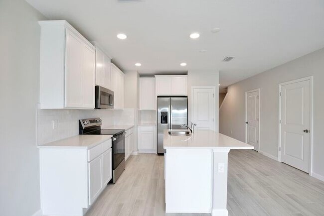 Building Photo - Brand-New 3/3 Modern Townhome in Gated Tys...