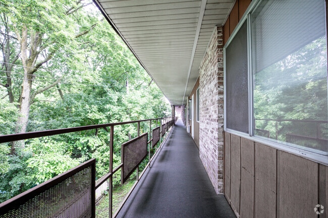 Exterior Hallway - CHARMING DOWNTOWN APARTMENTS