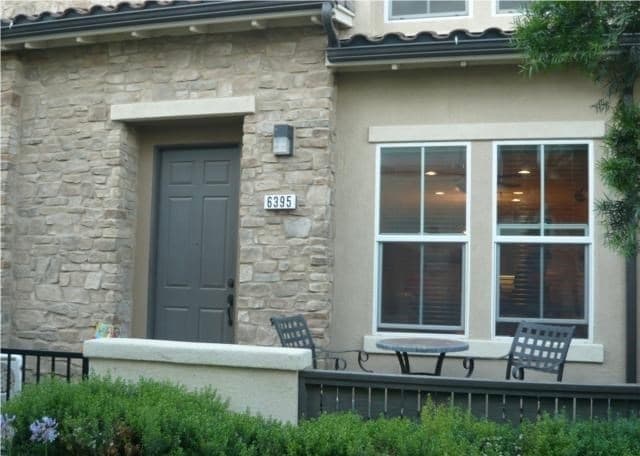 Front door with patio area for sitting and barbecue. - 6395 Delgado Ln Townhome