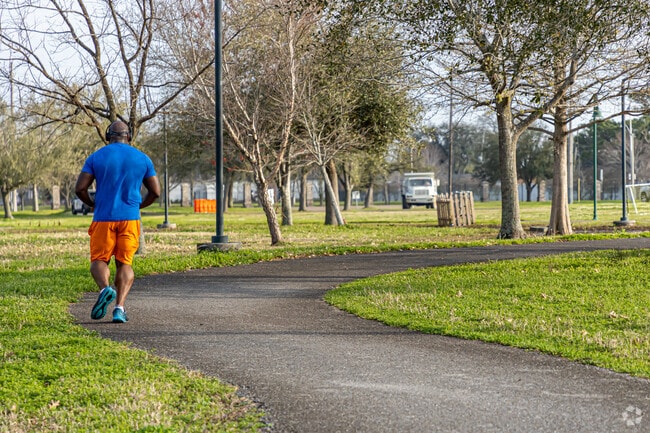 A resident running on the jogging path at Kenner City Park